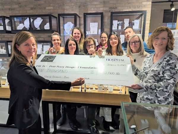 Dana signing cheque to Port Perry Hospital Foundation for $10,000