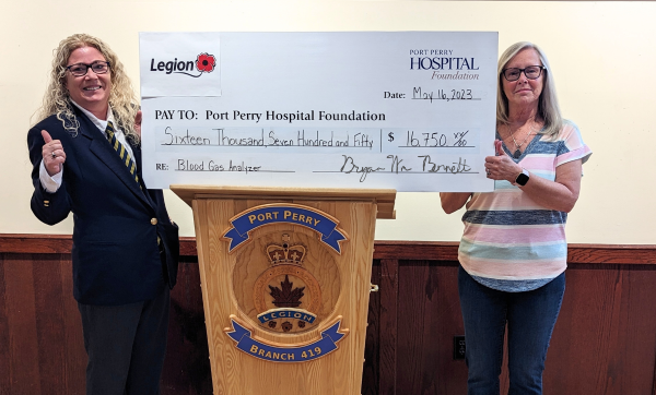 Kelly Walton presenting cheque to Kim Coates